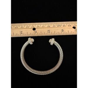 silver and gold colored metal bracelet with rhinestones